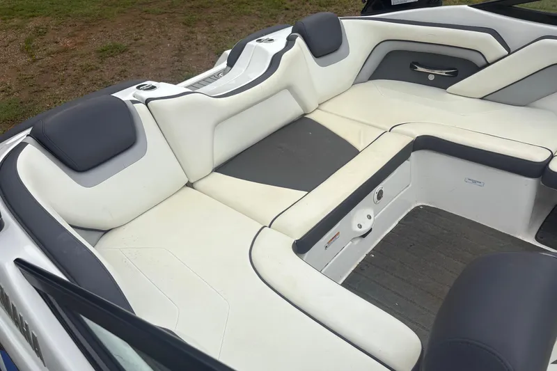 Slide: The Image of 2016 Yamaha Boats AR192 interior with white and gray seating, showcasing spacious and comfortable design. - 5