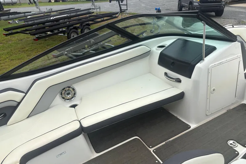 Slide: The Image of 2016 Yamaha Boats AR192 interior with white seating and speaker detail. - 8