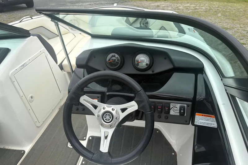 Slide: The Image of 2016 Yamaha Boats AR192 dashboard with steering wheel and control panel. - 7