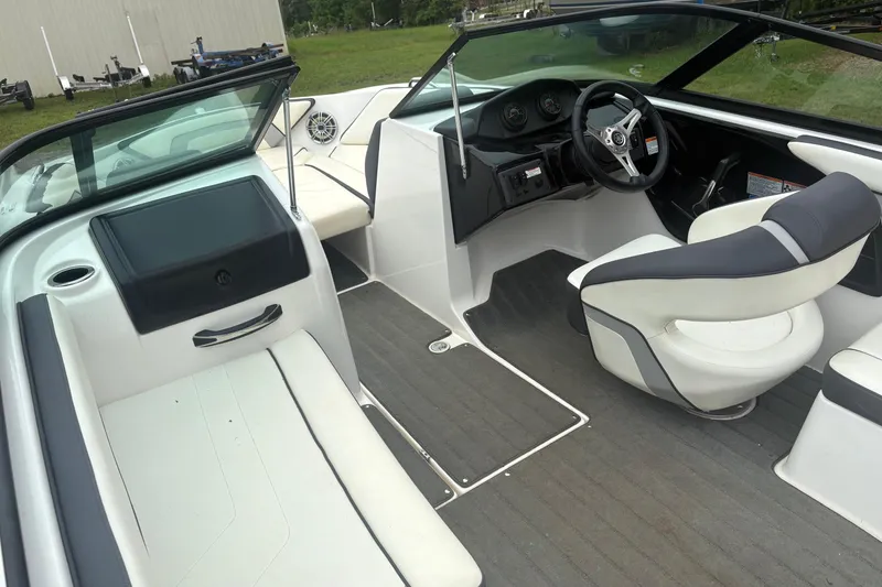 Slide: The Image of 2016 Yamaha Boats AR192 interior with sleek seating and modern dashboard design. - 10