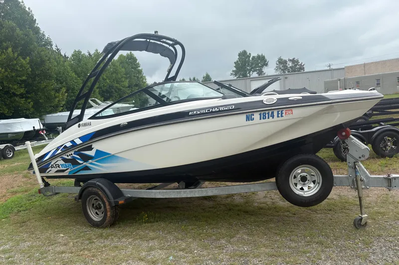 Slide: The Image of 2016 Yamaha Boats AR192 on trailer, featuring sleek design and vibrant graphics. - 2