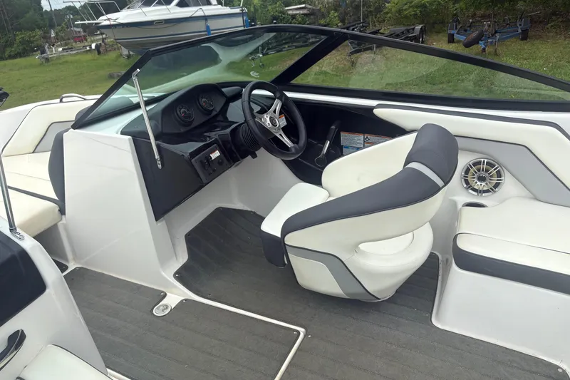 Slide: The Image of 2016 Yamaha Boats AR192 interior with steering wheel and seating, showcasing modern design. - 6