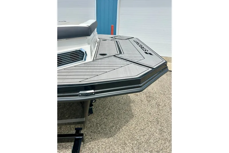 Slide: The Image of 2023 Starcraft SVX 211 IO boat with sleek deck design and modern detailing. - 31