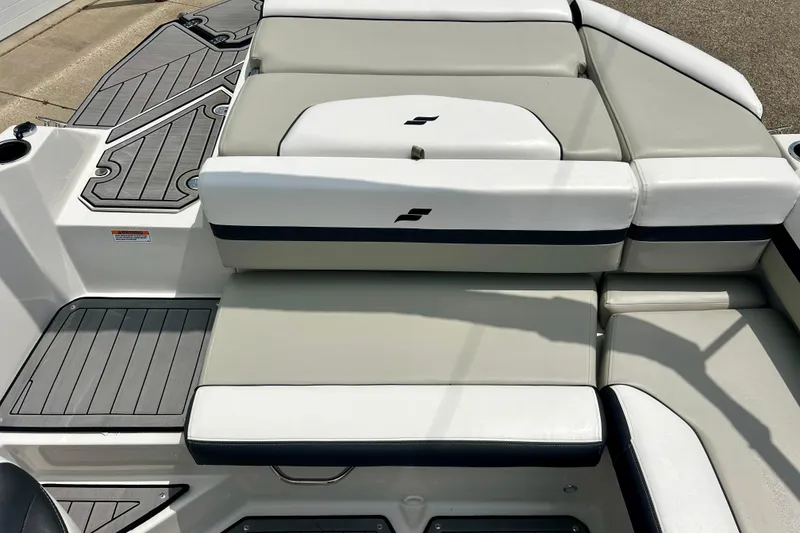 Slide: The Image of 2023 Starcraft SVX 211 IO boat interior with sleek, cushioned seating and modern design. - 48