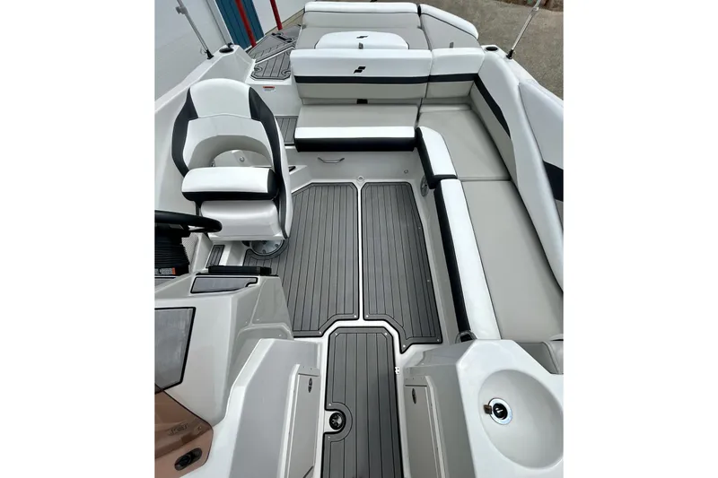 Slide: The Image of 2023 Starcraft SVX 211 IO boat interior with sleek seating and modern design. - 15