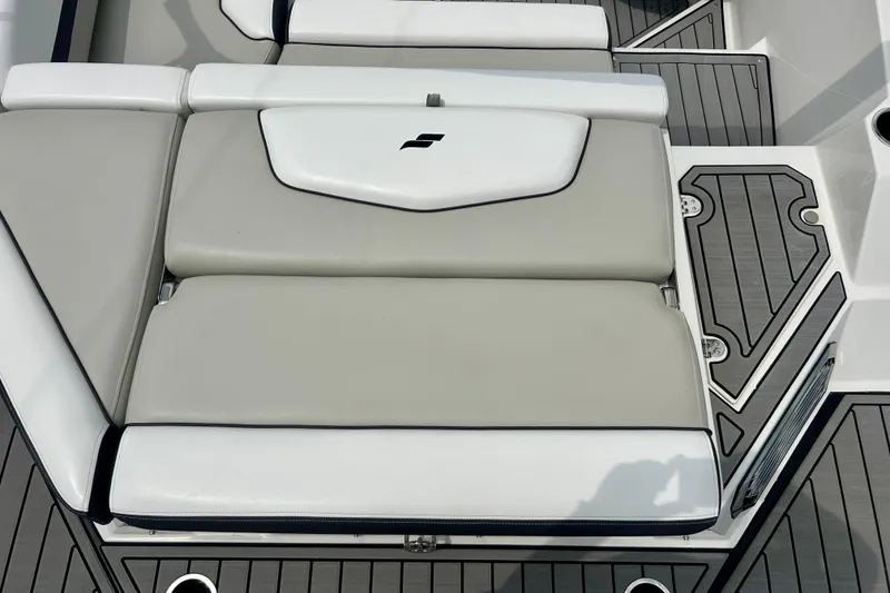Slide: The Image of 2023 Starcraft SVX 211 IO boat interior with cushioned seating and sleek design. - 9