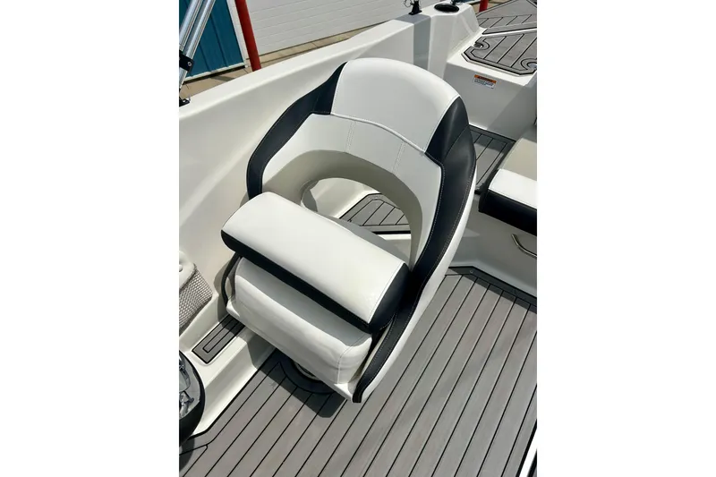 Slide: The Image of 2023 Starcraft SVX 211 IO boat seat with sleek black and white design. - 17