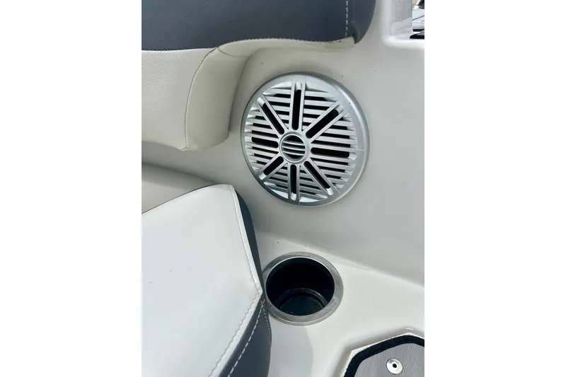 Slide: The Image of Speaker and cup holder on 2023 Starcraft SVX 211 IO boat interior. - 63