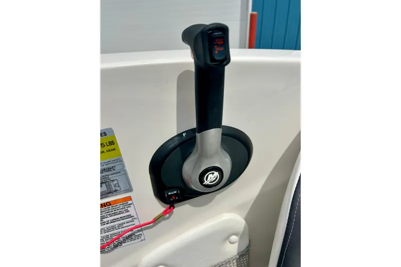 Slide: The Image of Throttle control of 2023 Starcraft SVX 211 IO boat, featuring ergonomic design and safety features. - 14