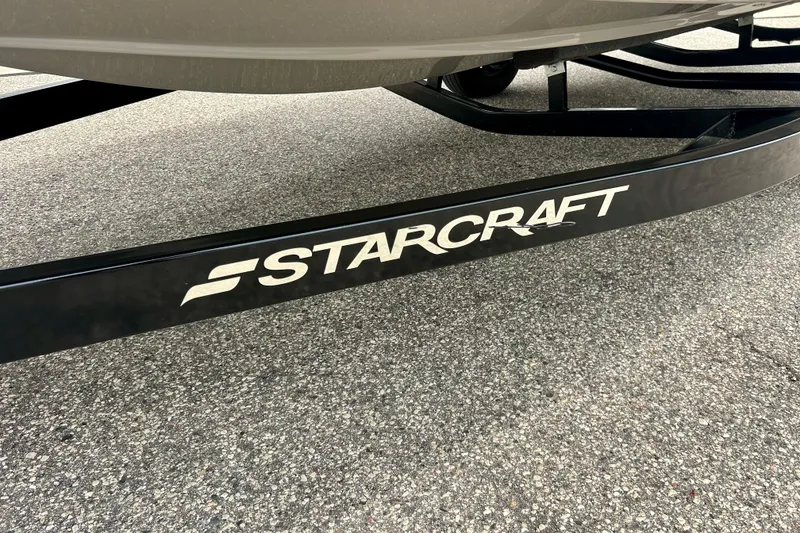 Slide: The Image of 2023 Starcraft SVX 211 IO boat trailer on asphalt surface. - 58