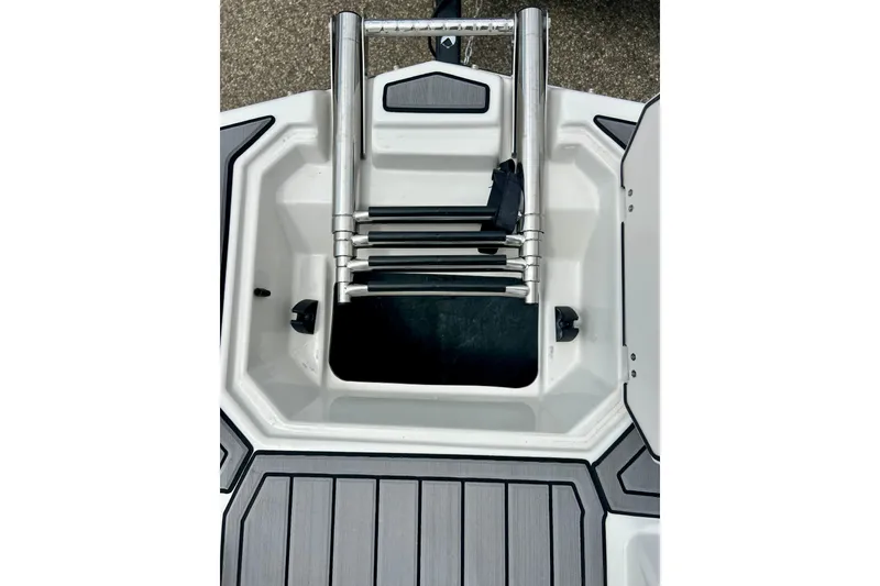 Slide: The Image of 2023 Starcraft SVX 211 IO boat ladder and storage compartment detail. - 45