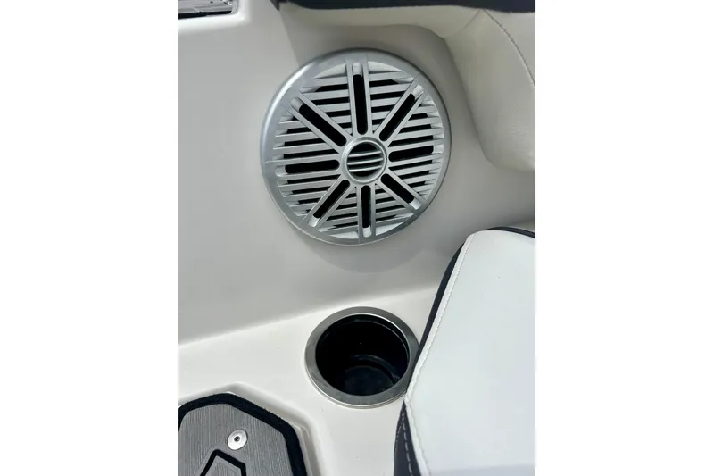 Slide: The Image of 2023 Starcraft SVX 211 IO boat interior with speaker and cup holder detail. - 12