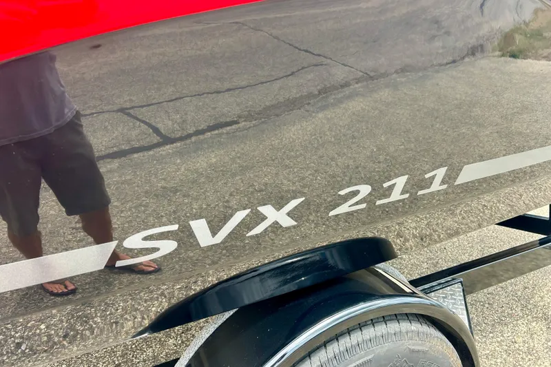 Slide: The Image of 2023 Starcraft SVX 211 IO boat exterior with model name visible on the side. - 35