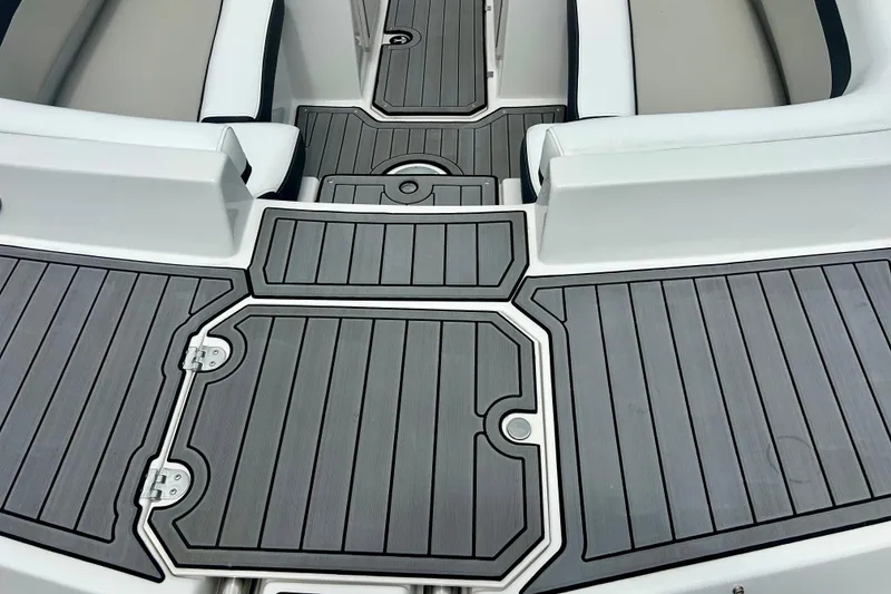 Slide: The Image of 2023 Starcraft SVX 211 IO boat deck with sleek, modern design and comfortable seating. - 62