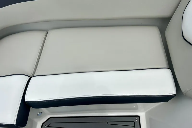 Slide: The Image of 2023 Starcraft SVX 211 IO boat seat with white and gray upholstery. - 40