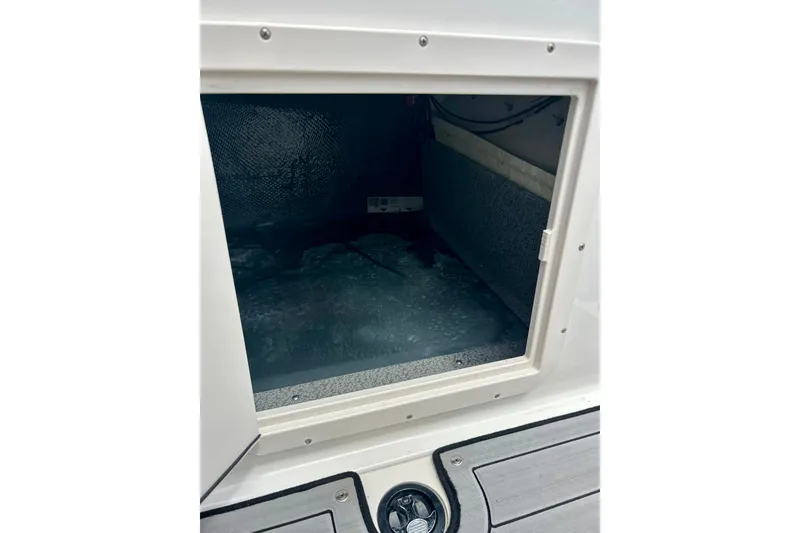 Slide: The Image of Storage compartment of 2023 Starcraft SVX 211 IO boat, featuring a spacious interior. - 51
