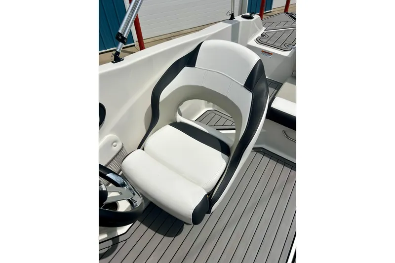 Slide: The Image of 2023 Starcraft SVX 211 IO boat seat with sleek white and black design. - 59