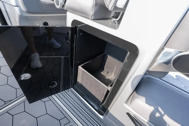 Slide: The Image of Open storage compartment on 2022 Fountain 38 SC boat, featuring sleek interior design. - 40