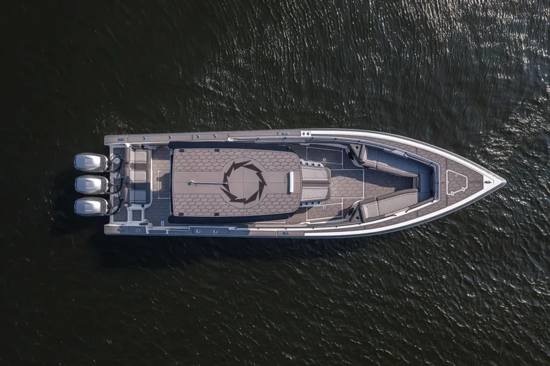 Slide: The Image of Aerial view of 2022 Fountain 38 SC boat with triple outboard motors on water. - 3