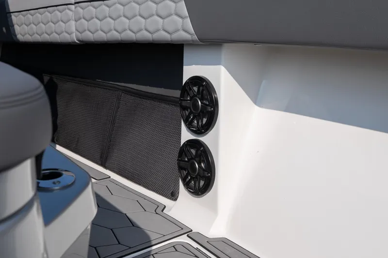 Slide: The Image of Interior of 2022 Fountain 38 SC boat with speakers and hexagonal seat pattern. - 16