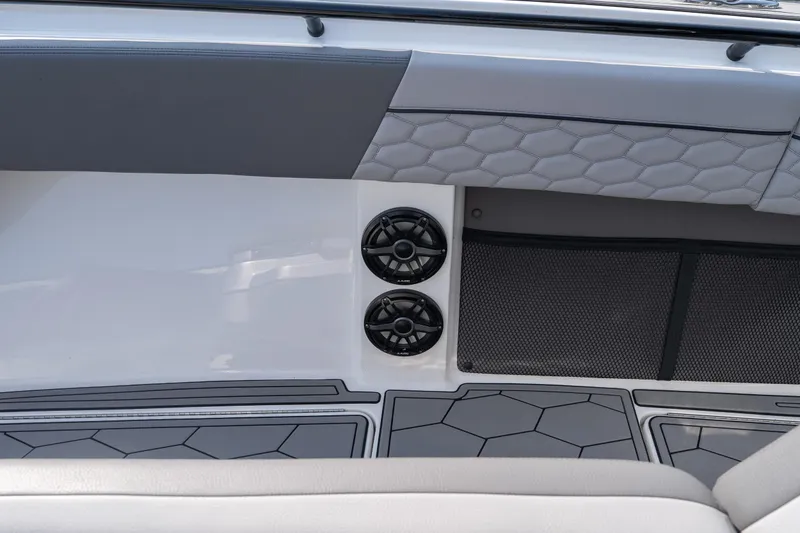 Slide: The Image of Interior of 2022 Fountain 38 SC boat with speakers and hexagonal pattern upholstery. - 12