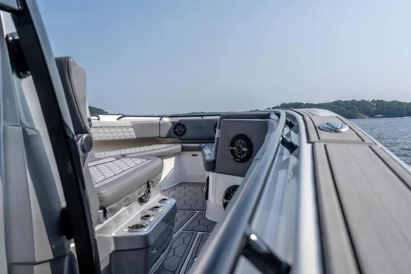 Slide: The Image of 2022 Fountain 38 SC boat interior with luxurious seating and scenic water view. - 29