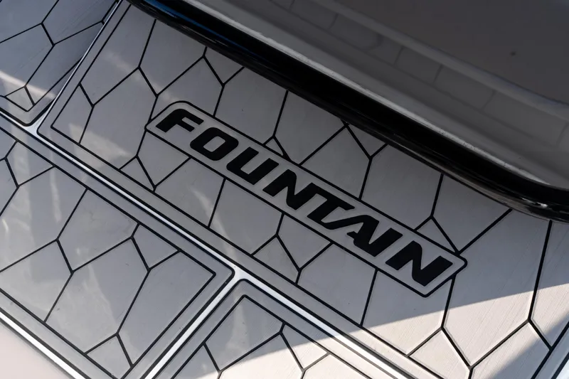 Slide: The Image of 2022 Fountain 38 SC boat deck with geometric pattern and logo. - 32