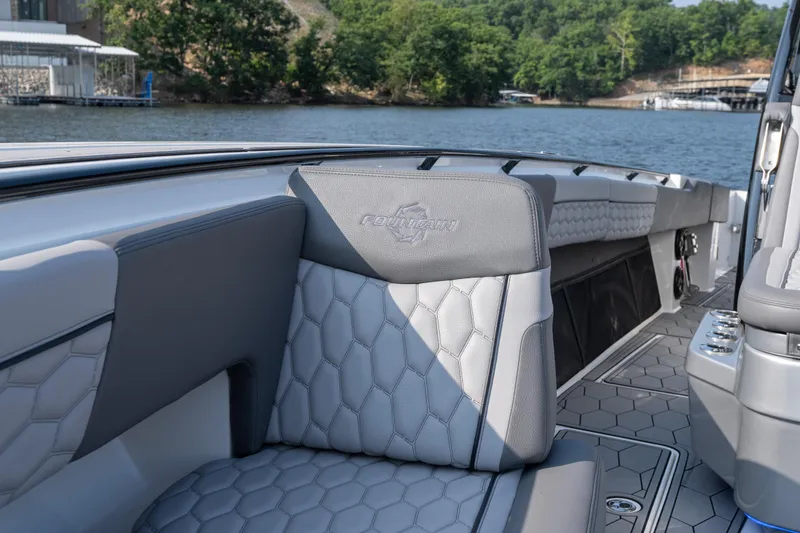 Slide: The Image of 2022 Fountain 38 SC boat interior with luxurious seating and scenic water view. - 15