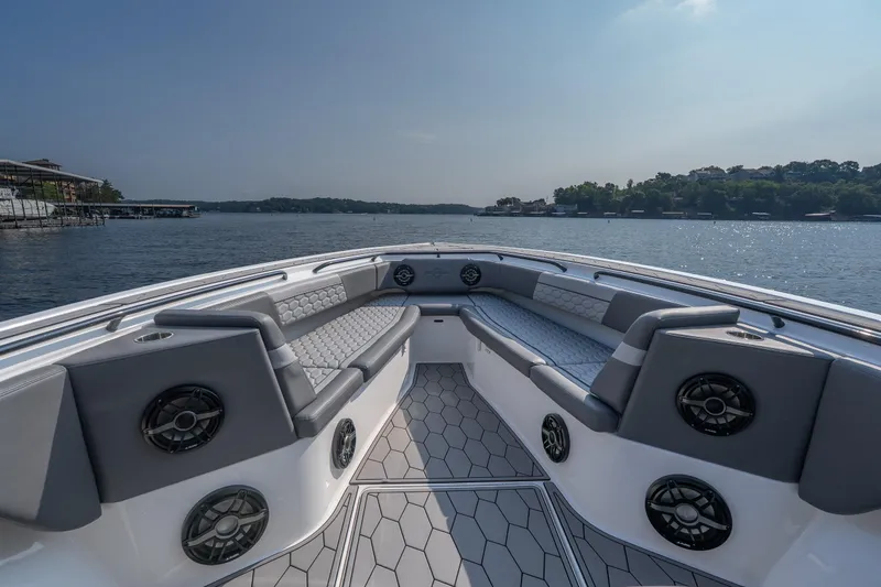 Slide: The Image of 2022 Fountain 38 SC boat interior with luxurious seating and scenic water view. - 11