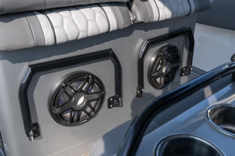 Slide: The Image of 2022 Fountain 38 SC boat interior with JL Audio speakers and cushioned seating. - 33