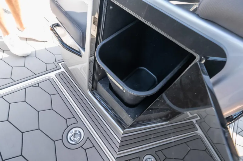Slide: The Image of 2022 Fountain 38 SC boat interior with open storage compartment and hexagonal floor design. - 41
