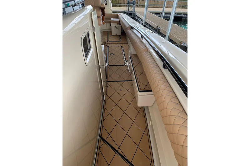 Slide: The Image of 2024 HCB 42 Lujo boat interior with tan quilted seating and sleek design. - 40