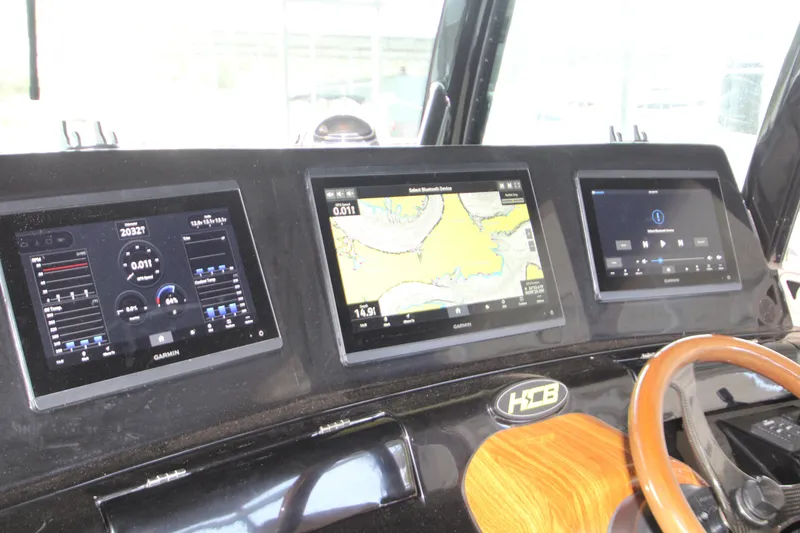 Slide: The Image of Dashboard of 2024 HCB 42 Lujo boat with Garmin navigation displays. - 24