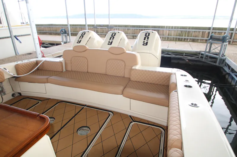Slide: The Image of Luxurious seating on 2024 HCB 42 Lujo boat with powerful engines in dock. - 66