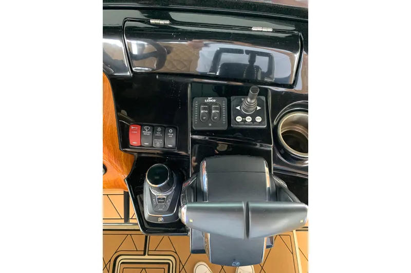 Slide: The Image of Control panel of 2024 HCB 42 Lujo boat with joystick and switches. - 36