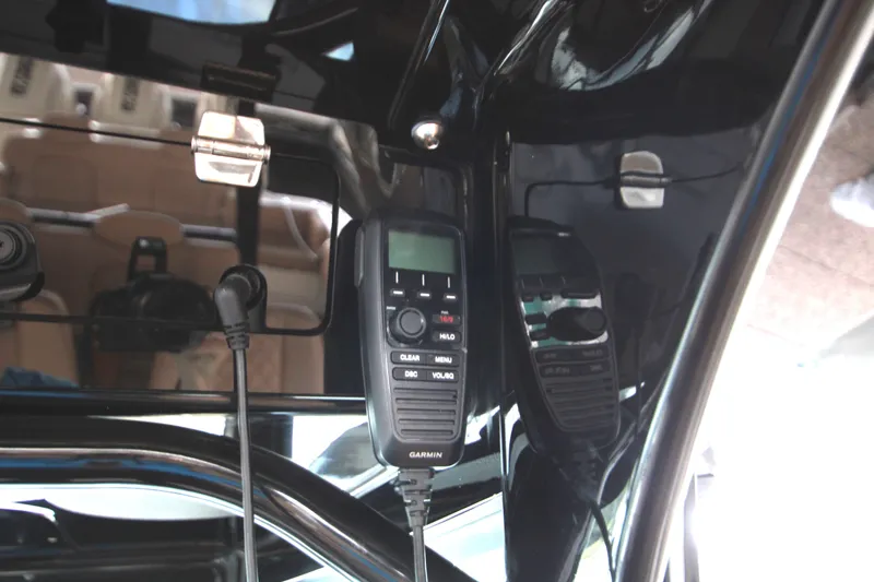 Slide: The Image of Garmin marine radio installed on 2024 HCB 42 Lujo boat dashboard. - 32