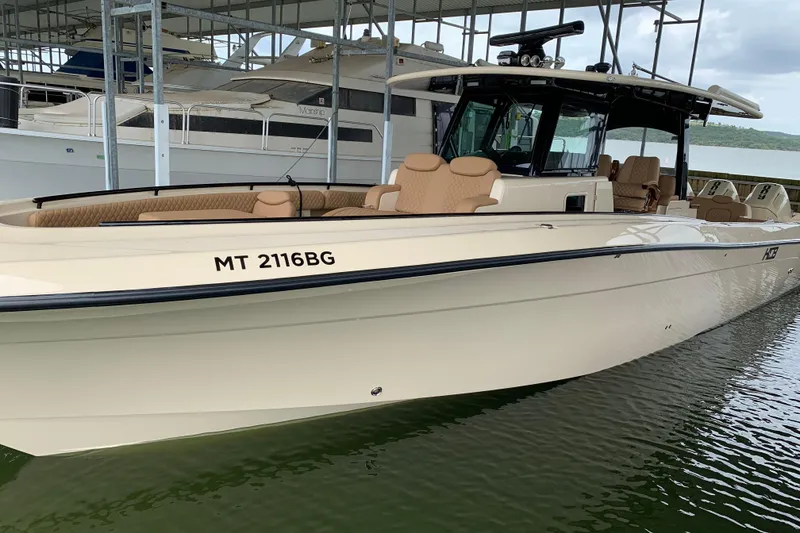 Slide: The Image of 2024 HCB 42 Lujo boat docked, featuring sleek design and luxurious seating. - 78