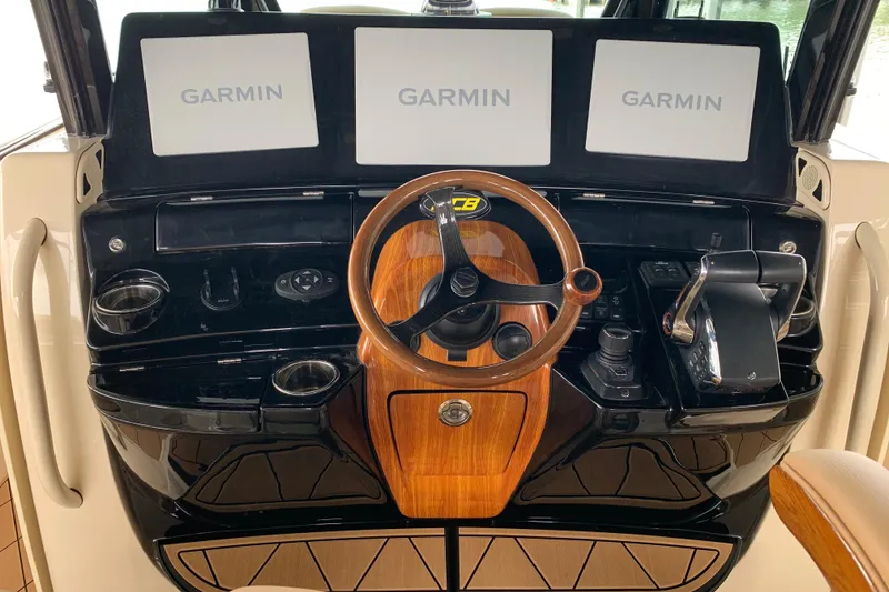 Slide: The Image of 2024 HCB 42 Lujo helm with Garmin displays and wooden steering wheel. - 37