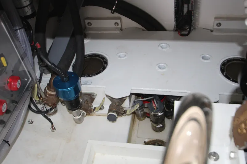 Slide: The Image of Engine compartment of 2024 HCB 42 Lujo boat, showcasing mechanical components and wiring. - 86