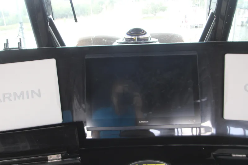 Slide: The Image of Dashboard of 2024 HCB 42 Lujo boat featuring Garmin navigation screens. - 30