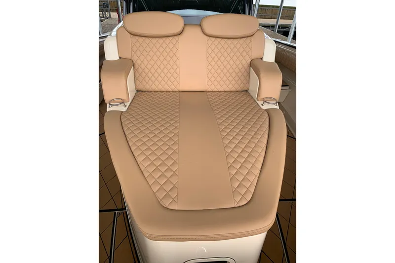 Slide: The Image of Luxurious tan seating on 2024 HCB 42 Lujo boat, featuring diamond-pattern upholstery. - 17