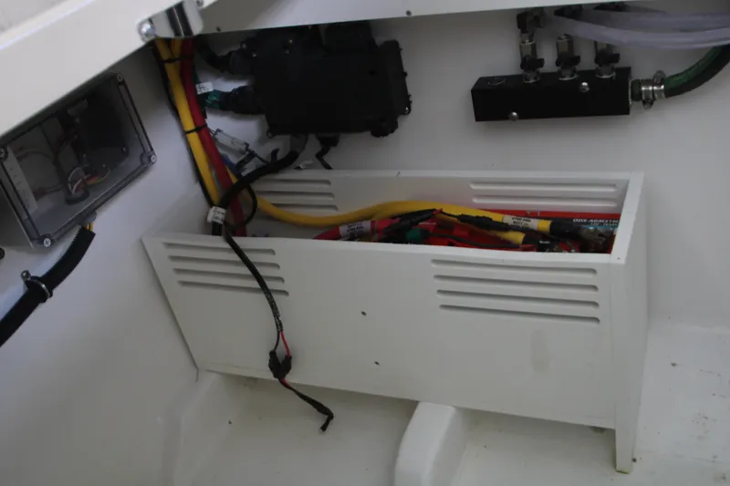 Slide: The Image of Electrical compartment of 2024 HCB 42 Lujo boat, featuring wiring and components. - 87