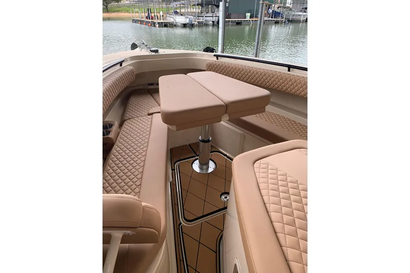 Slide: The Image of Luxurious interior of 2024 HCB 42 Lujo boat with quilted seating and adjustable table. - 21