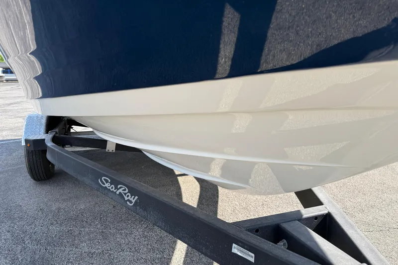Slide: The Image of 2023 Sea Ray SPX 190 boat on trailer, showcasing sleek hull design. - 27