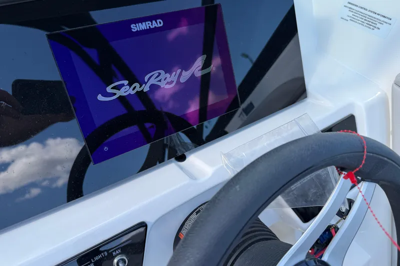 Slide: The Image of Simrad display on 2023 Sea Ray SPX 190 boat dashboard with steering wheel. - 31