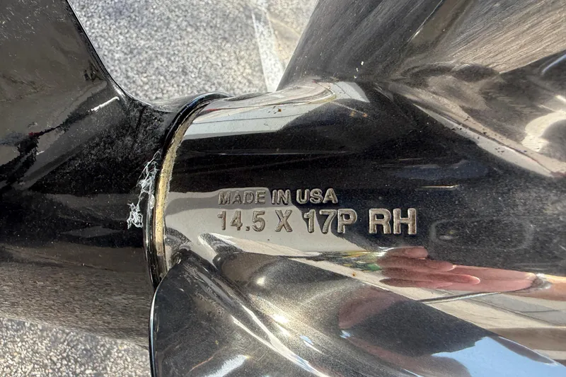 Slide: The Image of Close-up of a Sea Ray SPX 190 2023 boat propeller, marked "Made in USA 14.5 X 17P RH". - 23