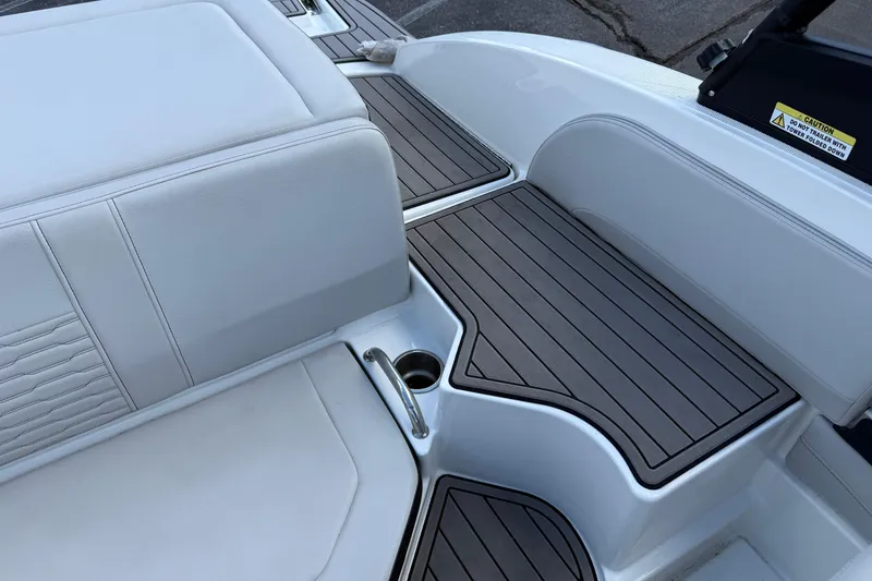 Slide: The Image of 2023 Sea Ray SPX 190 boat interior with sleek seating and stylish deck design. - 11