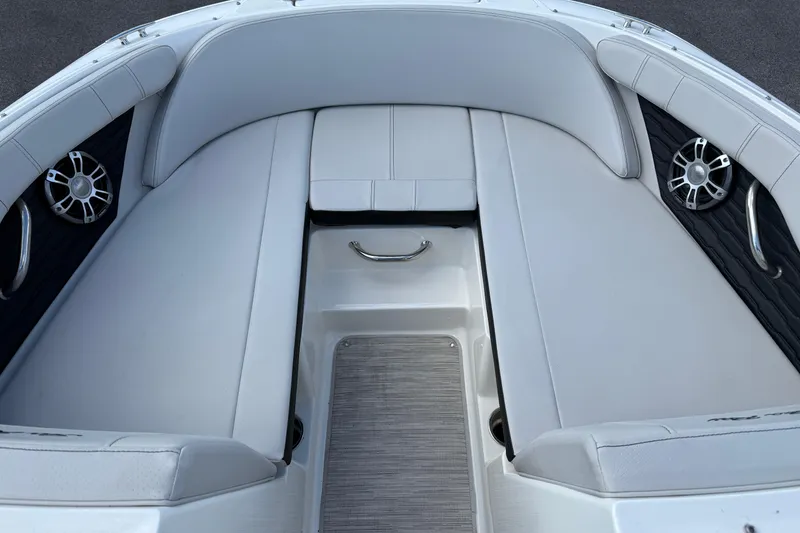 Slide: The Image of 2023 Sea Ray SPX 190 boat interior with cushioned seating and sleek design. - 17