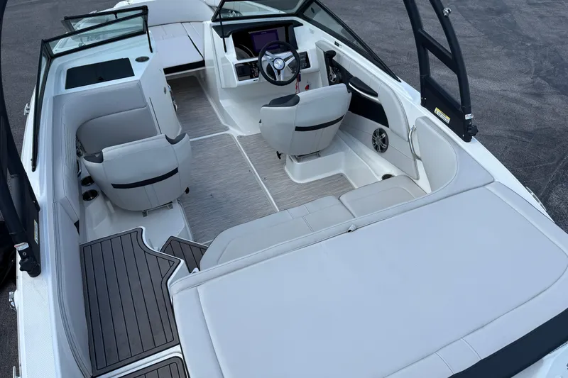 Slide: The Image of 2023 Sea Ray SPX 190 boat interior with modern seating and sleek design. - 12
