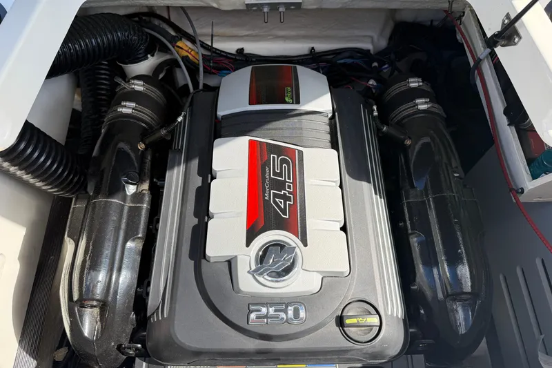 Slide: The Image of Engine compartment of a 2023 Sea Ray SPX 190 boat featuring a 4.5L MerCruiser engine. - 18